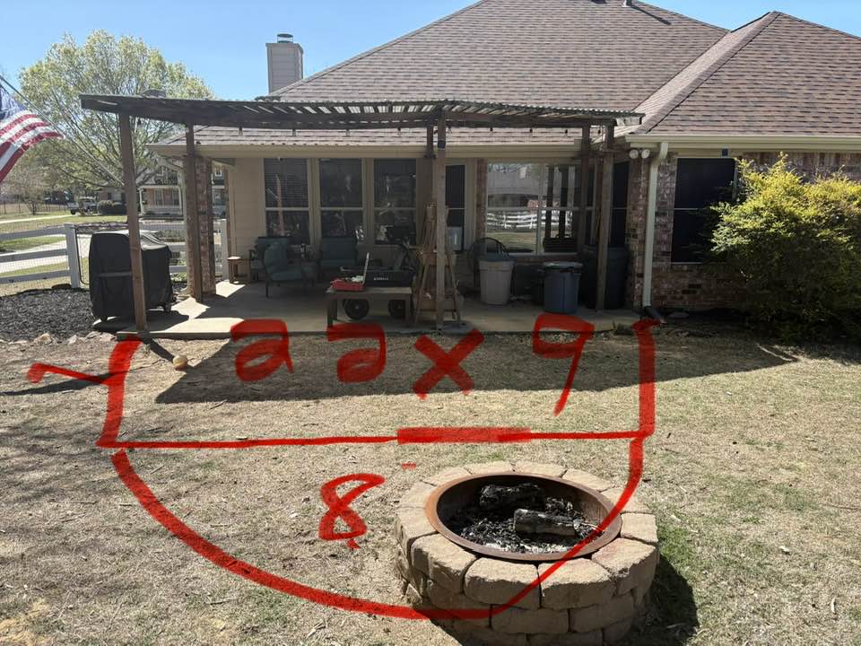 Before — old lean-to pergola with spray-paint layout marks for new concrete